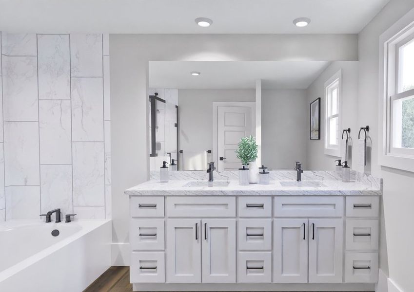 A bright bathroom featuring white cabinets and a spacious bathtub, creating a clean and modern aesthetic.