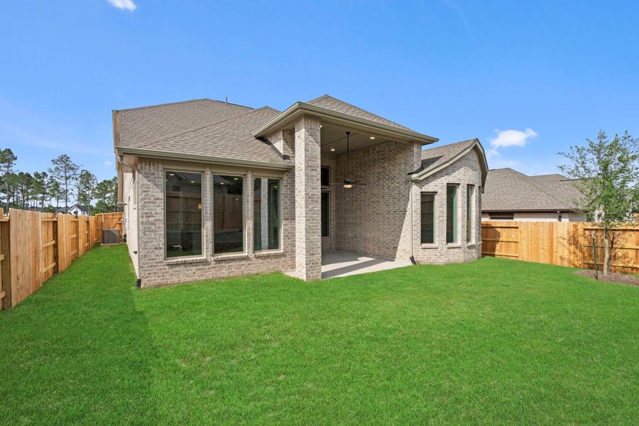 Exterior details and patio area of a home in Wildtree, Magnolia (Image 20).
