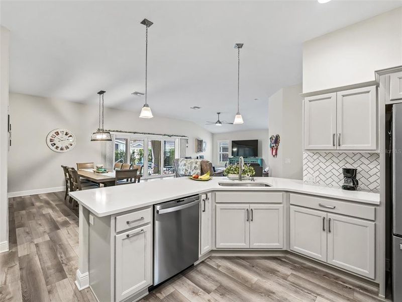 Kitchen with quartz counter tops and Marble backsplash in herringbone pattern