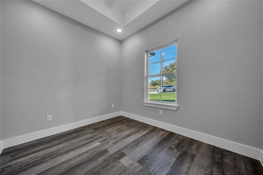 Spare room featuring dark hardwood / wood-style flooring