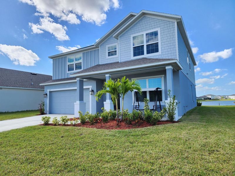 Front exterior of a new home in , Port St. Lucie, FL, highlighting curb appeal (Image 27). Front exterior of a new home in , Port St. Lucie, FL, highlighting curb appeal (Image 27).