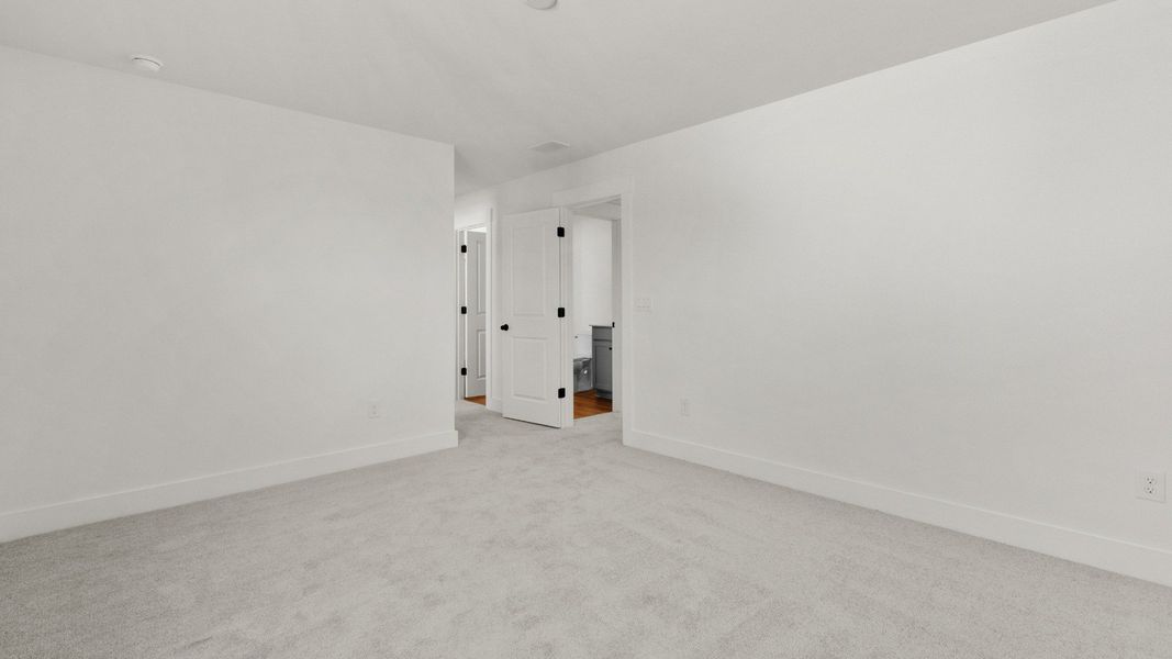 A roomy fourth bedroom designed for convenience and comfort.
