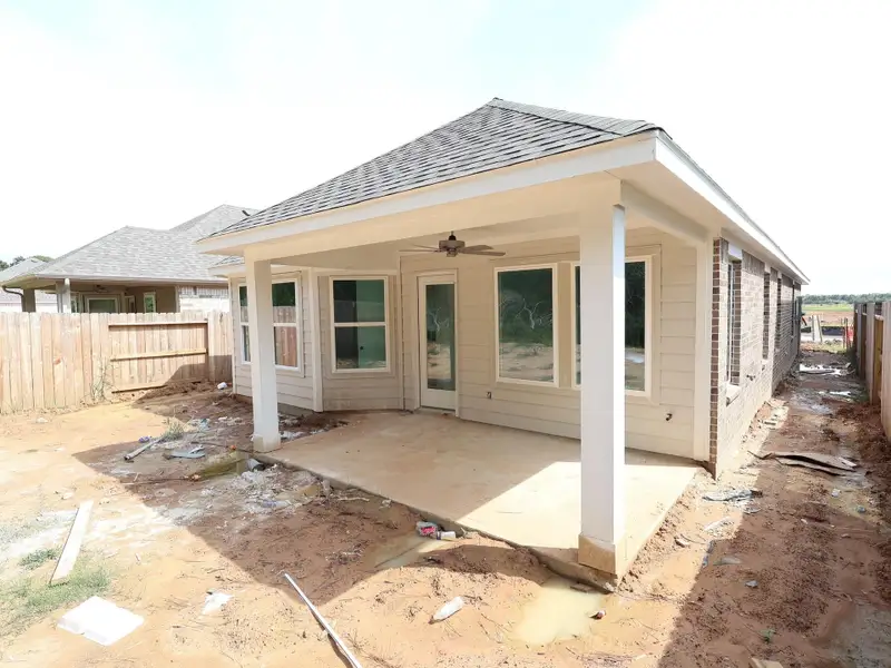 Front exterior of a new home in Sorella, Tomball, TX, highlighting curb appeal (Image 1). Front exterior of a new home in Sorella, Tomball, TX, highlighting curb appeal (Image 1).