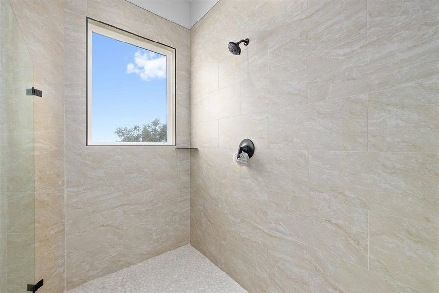Bathroom with tiled shower