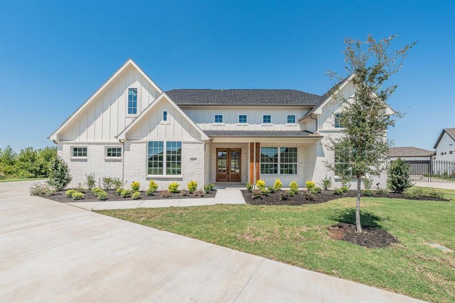 Front exterior of a new home in , Haslet, TX, highlighting curb appeal (Image 1).