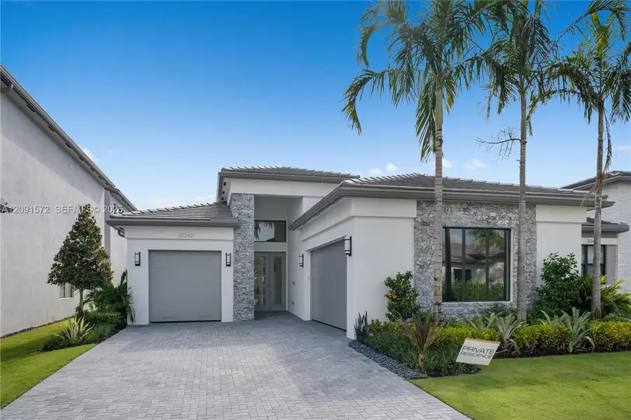 Front exterior of a new home in , Boca Raton, FL, highlighting curb appeal (Image 1). Front exterior of a new home in , Boca Raton, FL, highlighting curb appeal (Image 1).