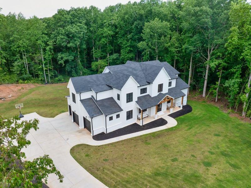 Front exterior of a new home in , Buford, GA, highlighting curb appeal (Image 2). Front exterior of a new home in , Buford, GA, highlighting curb appeal (Image 2).
