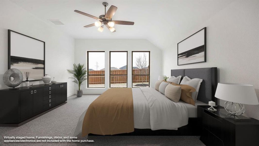 Carpeted bedroom with visible vents and a ceiling fan