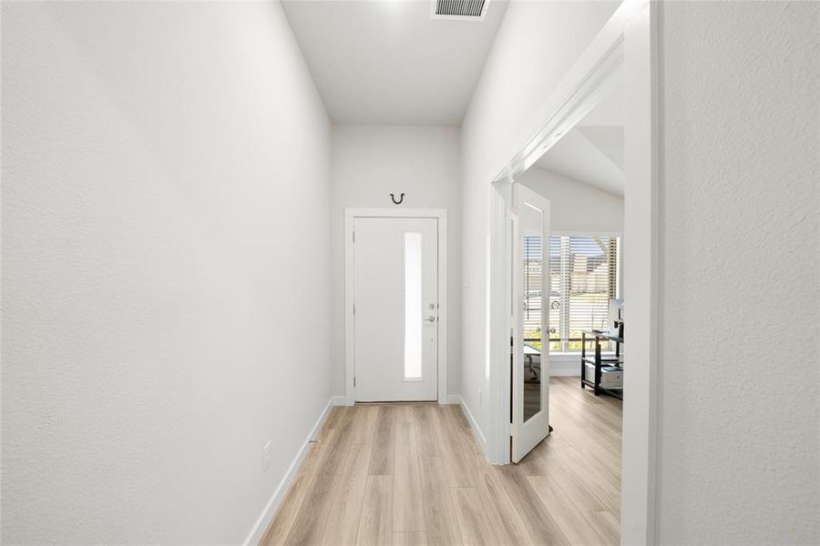 Foyer with light wood-type flooring