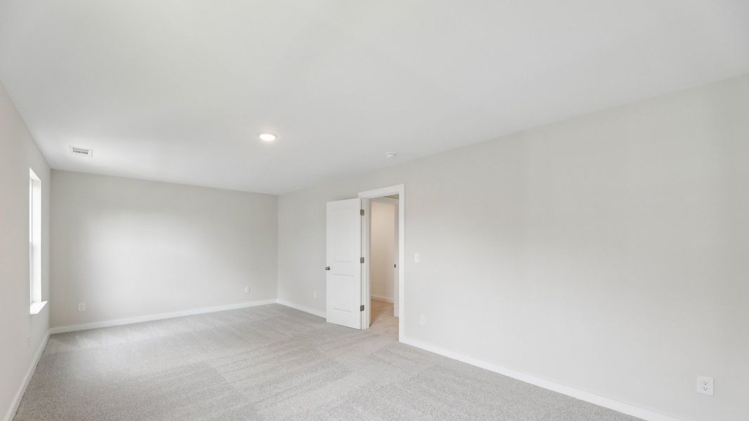 Storage room with windows and carpet