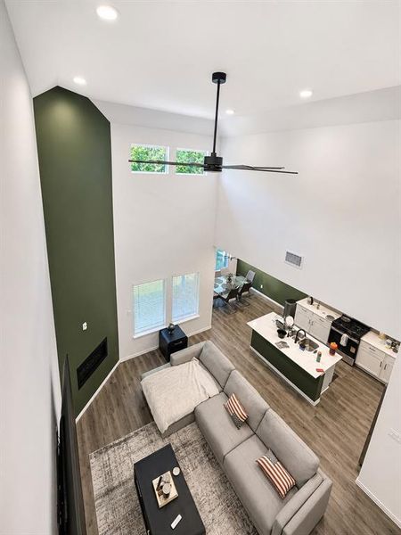 Soaring ceilings featuring a modern ceiling fan and recessed lighting
