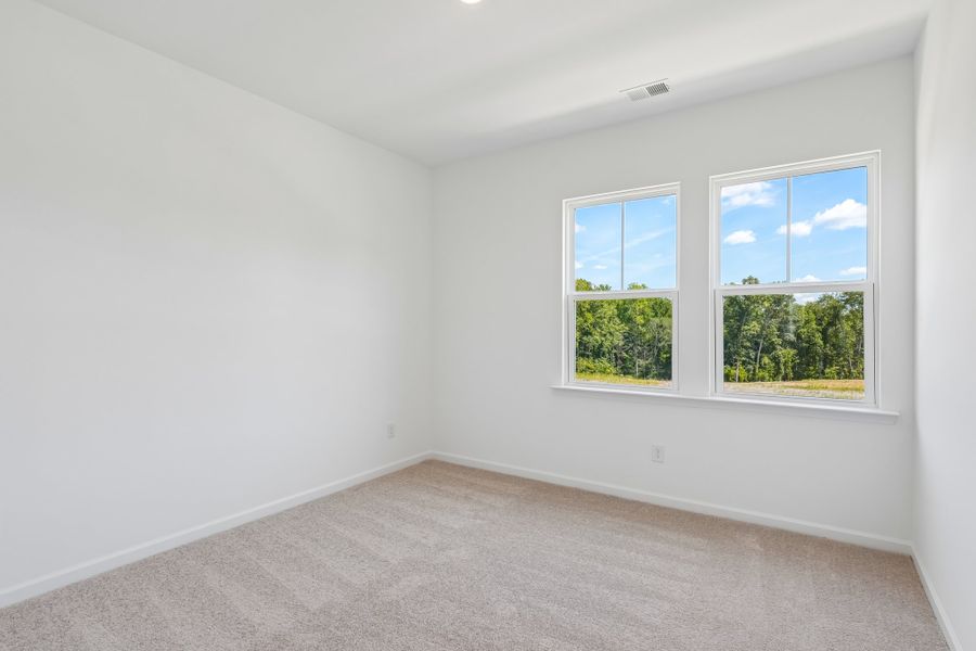 Spacious, unfurnished interior of a new home in Terraces at the Exchange, Indian Land (Image 26).