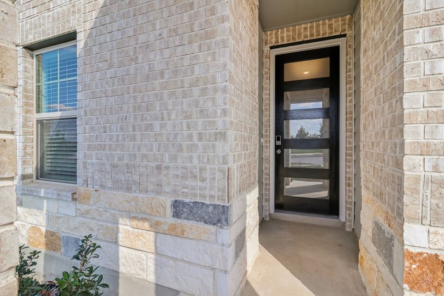 Front exterior of the Briscoe floorplan at a Meritage Homes community.