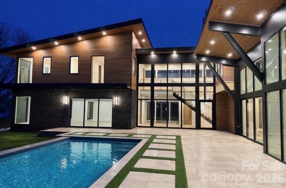 60’ double infinity edge saltwater lap pool w/ Cabo shelf & integrated hot tub