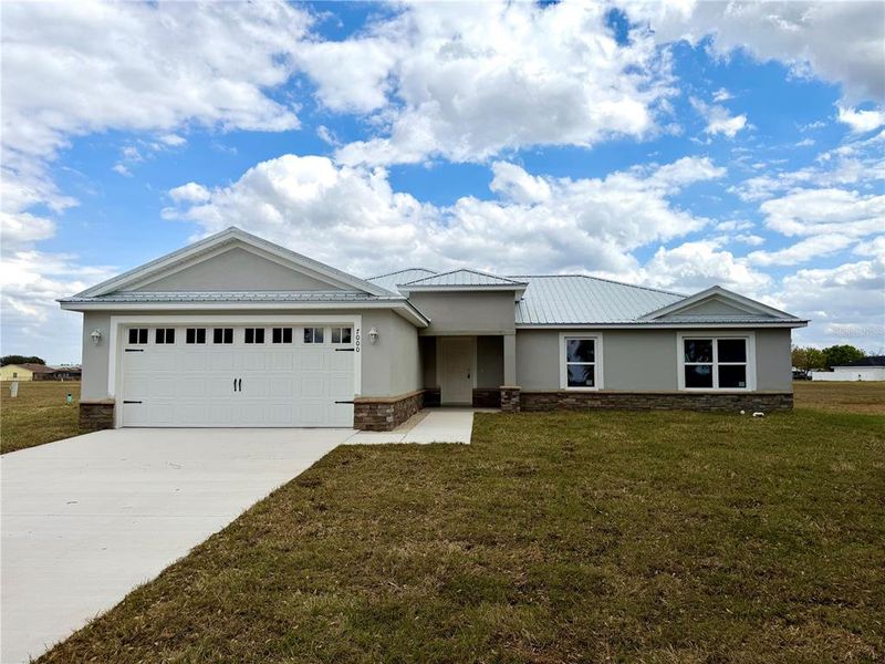 Front exterior of a new home in , Sebring, FL, highlighting curb appeal (Image 1). Front exterior of a new home in , Sebring, FL, highlighting curb appeal (Image 1).