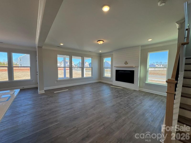 Family room with gas fireplace & shiplap wall