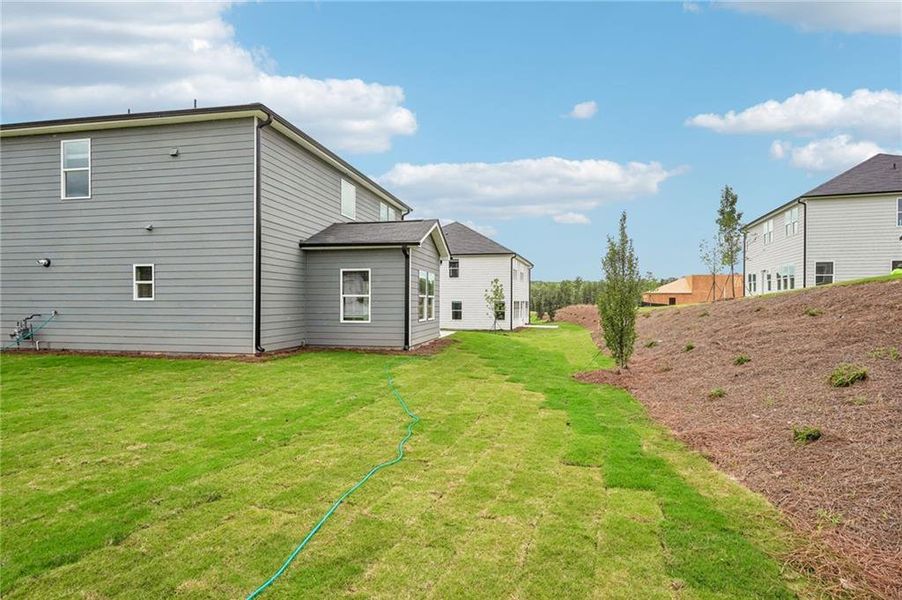 Exterior details and patio area of a home in Northwoods at Mirror Lake, Villa Rica (Image 33).