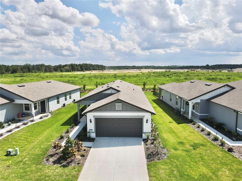 Front exterior of a new home in , Ocala, FL, highlighting curb appeal (Image 17).