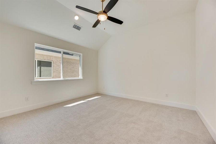 Unfurnished room featuring vaulted ceiling, light carpet, recessed lighting, and a ceiling fan Unfurnished room featuring vaulted ceiling, light carpet, recessed lighting, and a ceiling fan