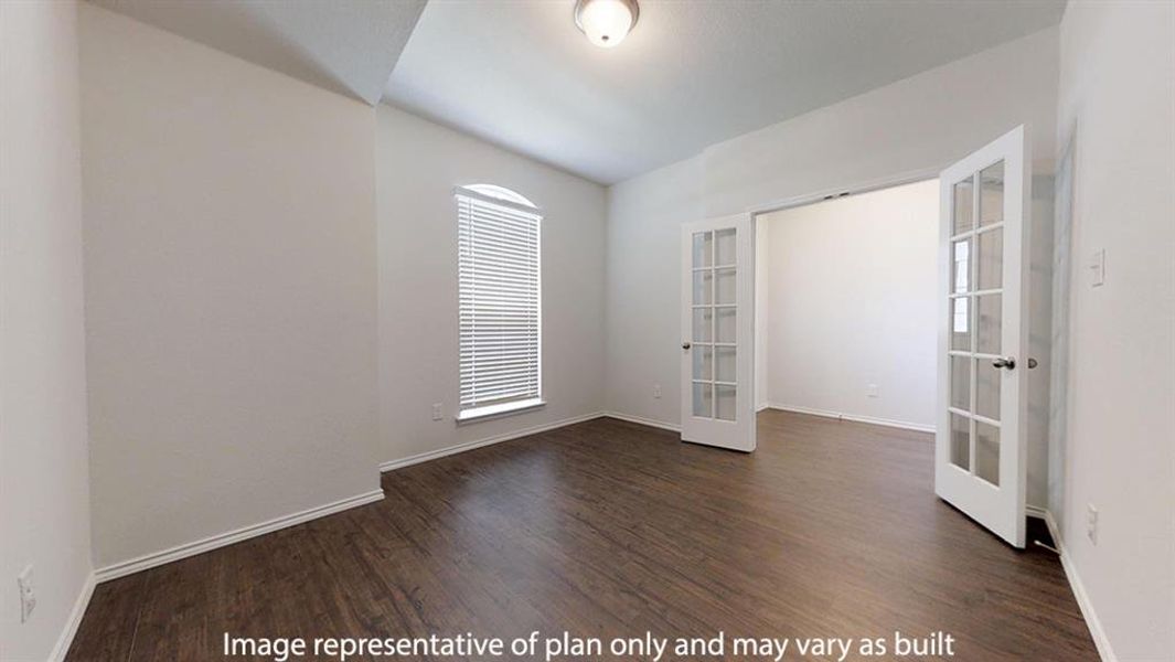 Empty room with french doors and dark wood-style flooring Empty room with french doors and dark wood-style flooring