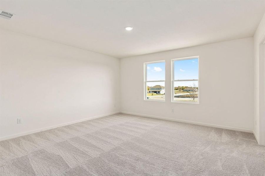 Unfurnished room featuring light carpet and recessed lighting Unfurnished room featuring light carpet and recessed lighting