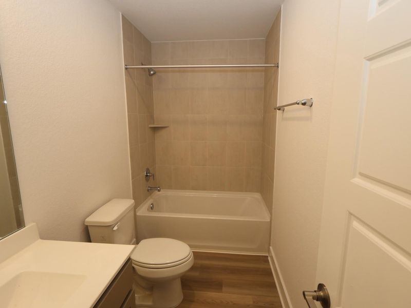 Furnished interior view inside a new home in Lone Star Landing, Montgomery (Image 9).