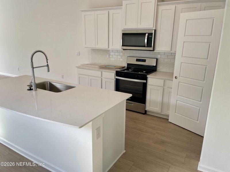 Furnished interior view inside a new home in Grand Reserve, Bunnell (Image 5).
