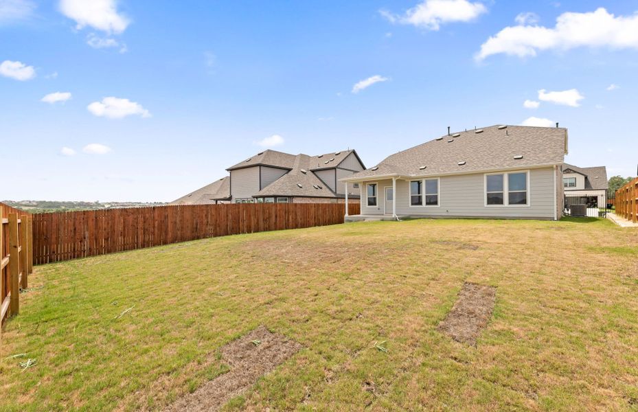 Exterior details and patio area of a home in Saddleback at Santa Rita Ranch, Liberty Hill (Image 22).