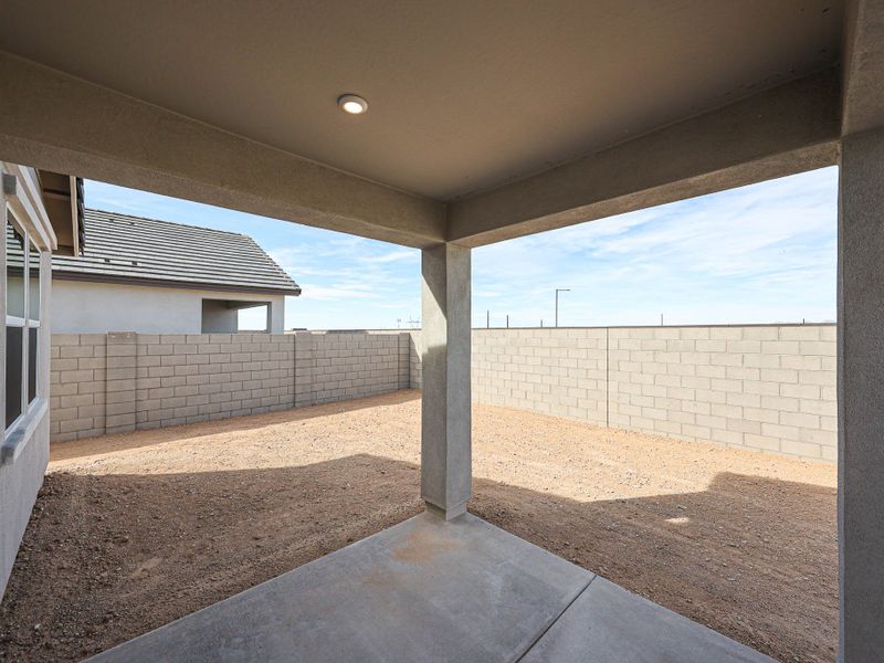 A building with a stone patio.