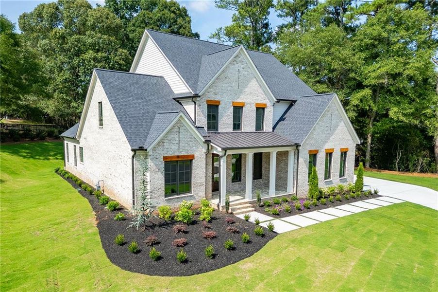 Front exterior of a new home in , Buford, GA, highlighting curb appeal (Image 37).