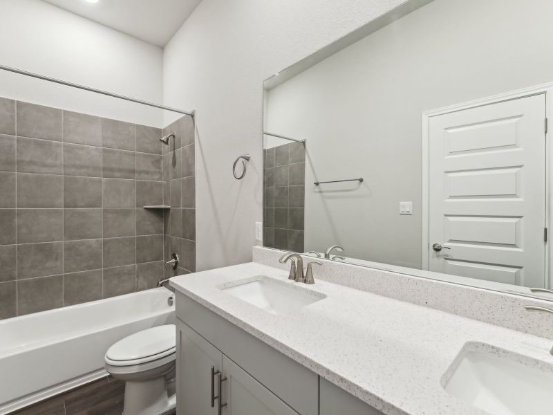 Furnished interior view inside a new home in Big Sky Ranch - Executive Collection, Dripping Springs (Image 7).