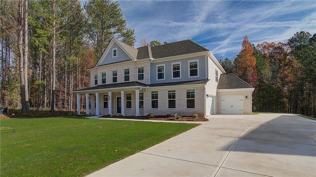 Front exterior of a new home in Trinity Park, McDonough, GA, highlighting curb appeal (Image 19).