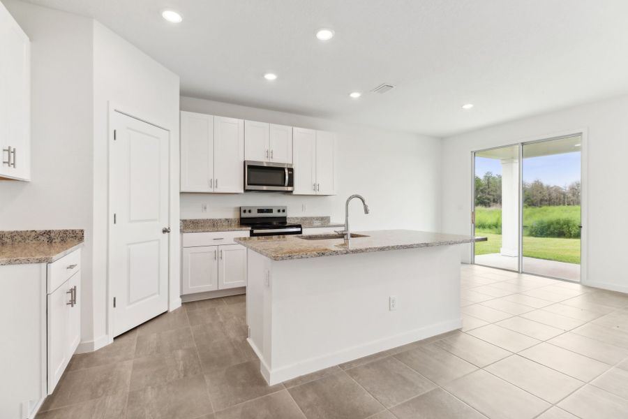 Kitchen of the Bluebell plan in Lakes at Bella Lago.