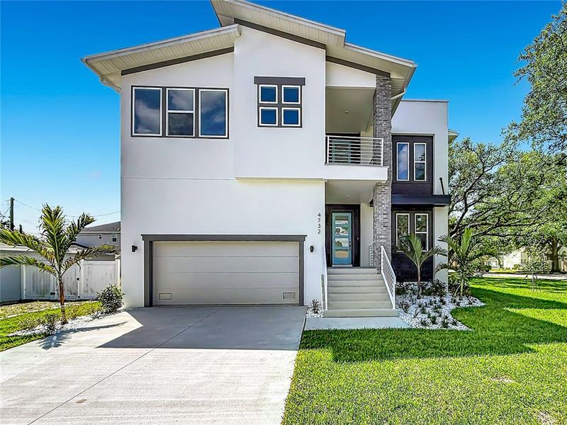 Front exterior of a new home in , Tampa, FL, highlighting curb appeal (Image 1). Front exterior of a new home in , Tampa, FL, highlighting curb appeal (Image 1).