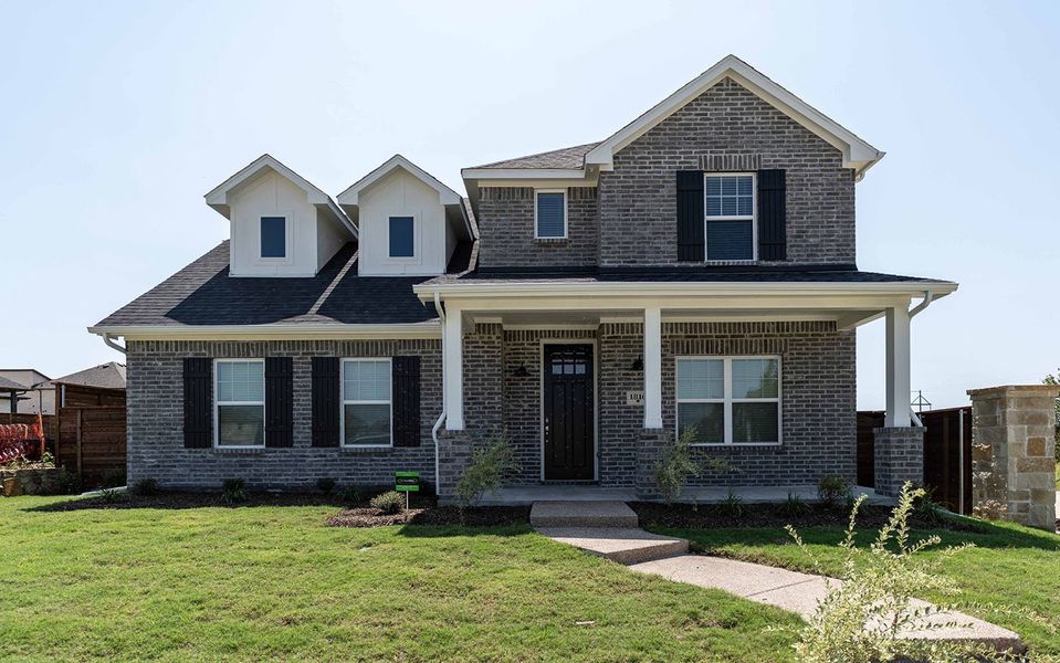 Front exterior of a new home in Solterra, Mesquite, TX, highlighting curb appeal (Image 1). Front exterior of a new home in Solterra, Mesquite, TX, highlighting curb appeal (Image 1).