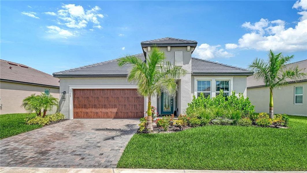 Front exterior of a new home in , Parrish, FL, highlighting curb appeal (Image 1). Front exterior of a new home in , Parrish, FL, highlighting curb appeal (Image 1).
