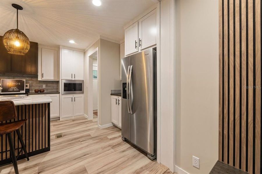 Furnished interior view inside a new home in , Okeechobee (Image 9).