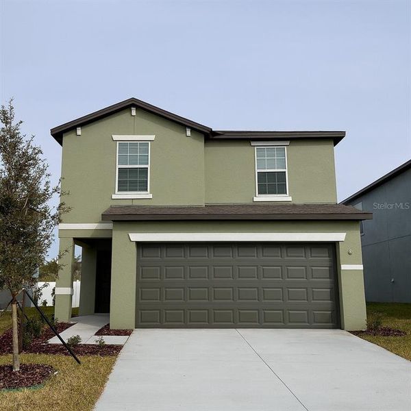 Front exterior of a new home in , Zephyrhills, FL, highlighting curb appeal (Image 1). Front exterior of a new home in , Zephyrhills, FL, highlighting curb appeal (Image 1).