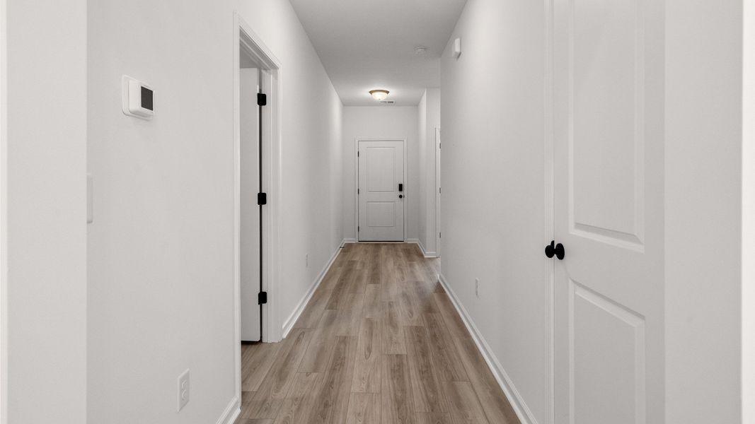 Spacious hallway provides easy access to secondary bedrooms