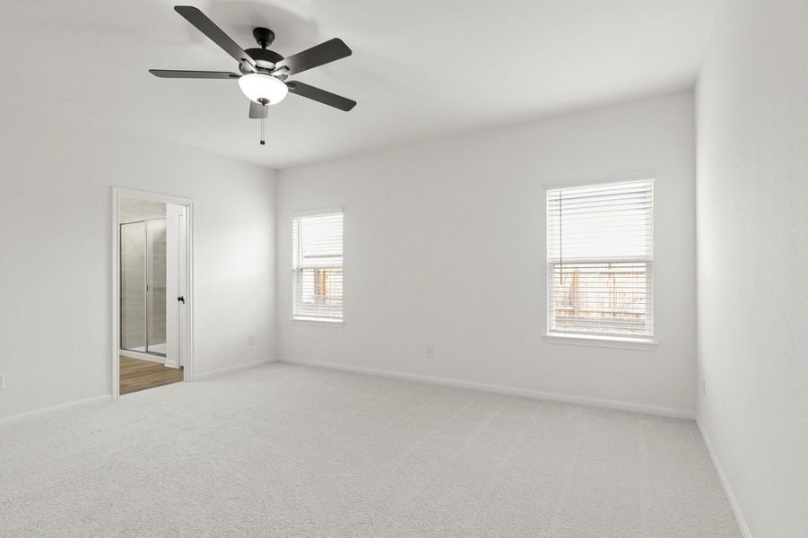 Unfurnished bedroom featuring light carpet, a ceiling fan, and ensuite bathroom