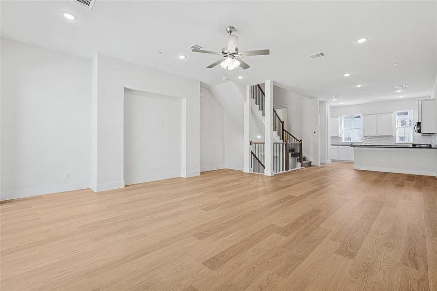 Unfurnished living room featuring recessed lighting, light wood-style flooring, and ceiling fan