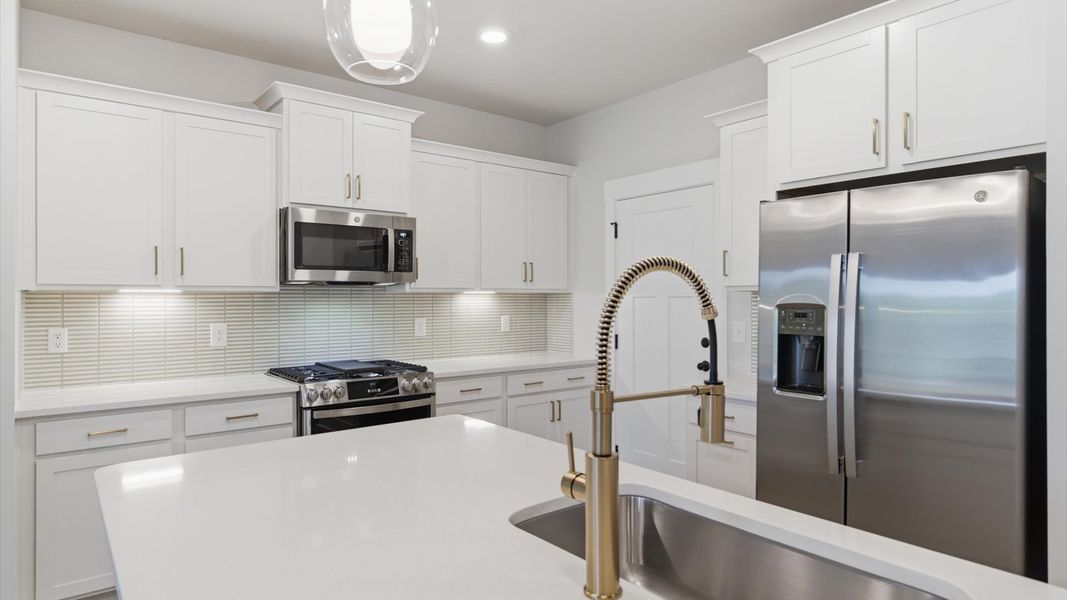 Furnished interior view inside a new home in Village at Midway, Anderson (Image 12).