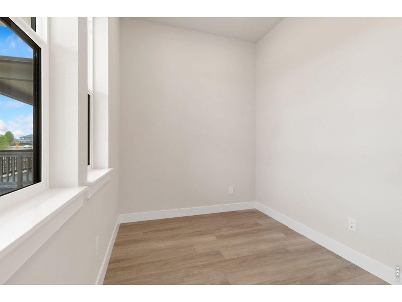 Spacious, unfurnished interior of a new home in RainDance, Windsor (Image 9).