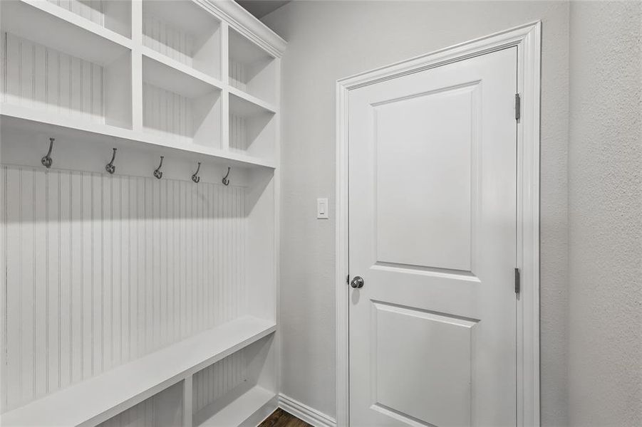 Mudroom with baseboards and dark wood finished floors