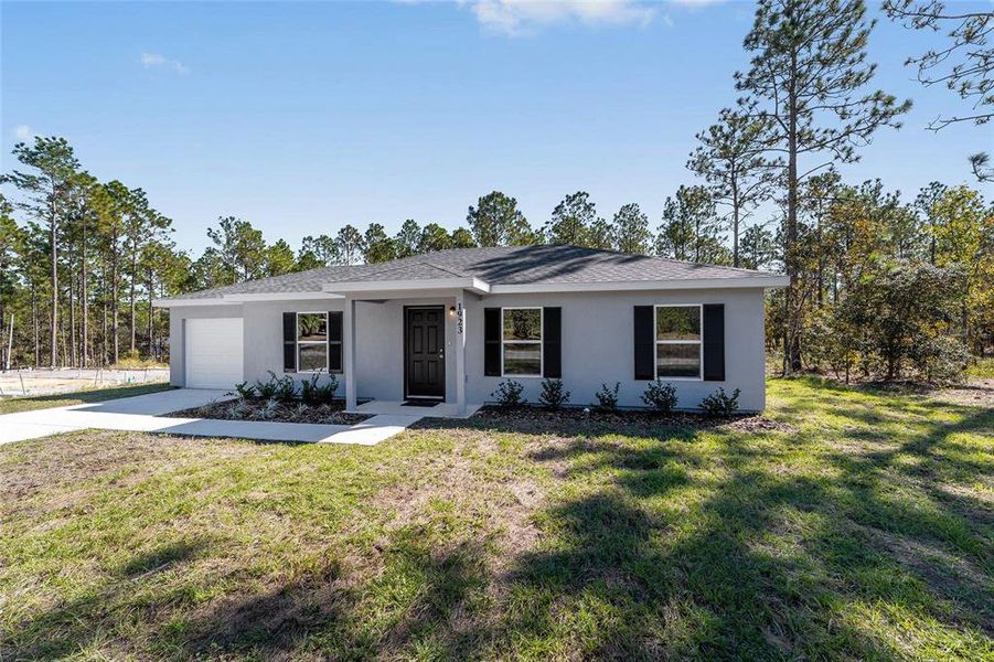 Front exterior of a new home in , Dunnellon, FL, highlighting curb appeal (Image 17). Front exterior of a new home in , Dunnellon, FL, highlighting curb appeal (Image 17).