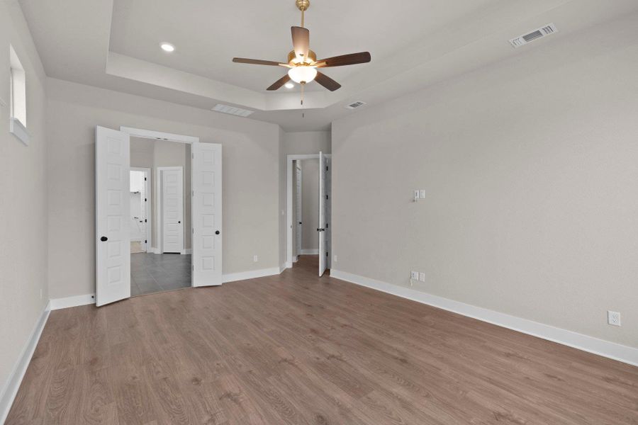 Primary Bedroom with tray ceiling