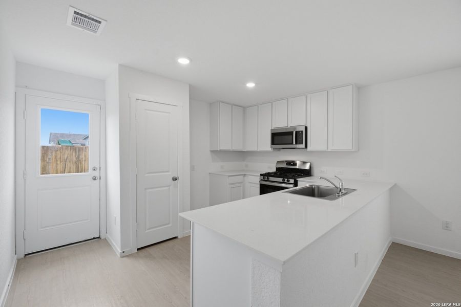 Furnished interior view inside a new home in Rose Valley, Converse (Image 6).