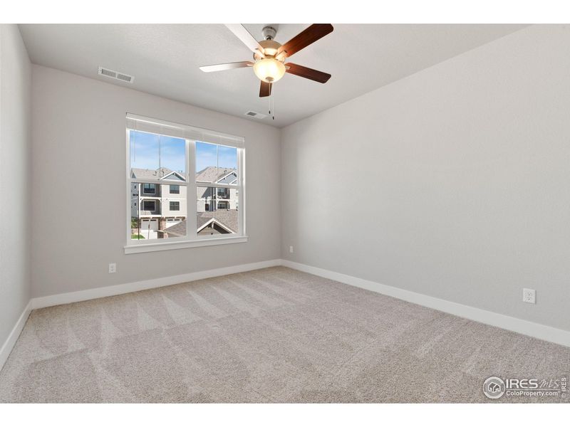 Spacious, unfurnished interior of a new home in The Lakes at Centerra - North Shore Flats, Loveland (Image 8).