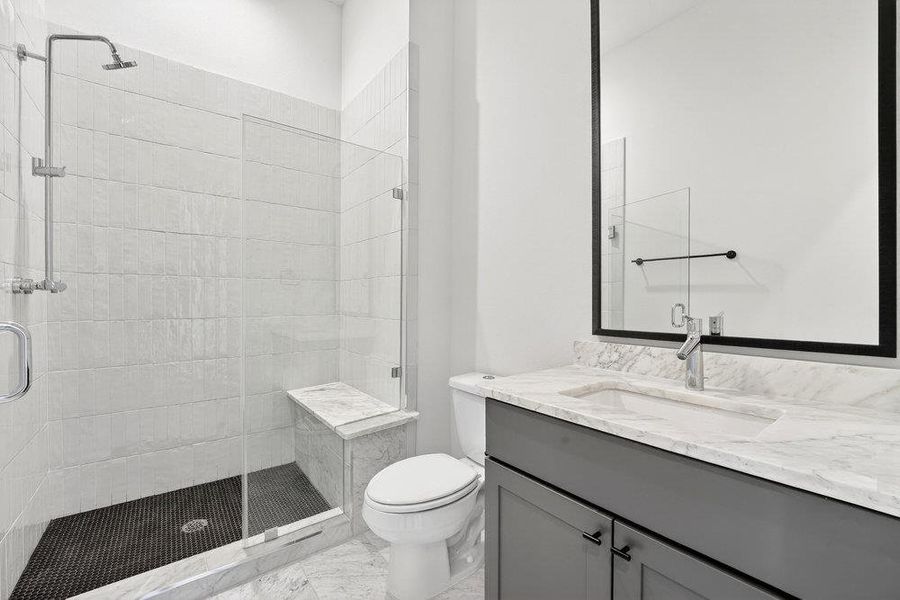Bathroom with vanity and a shower stall