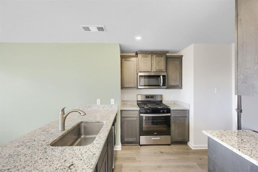 Furnished interior view inside a new home in Patriot Estates, Venus (Image 7).